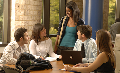Five students studying as a group inside the Law School