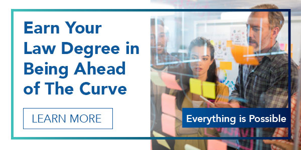 Everything is possible, Learn More. With a photo of students looking at post-it notes on a board.