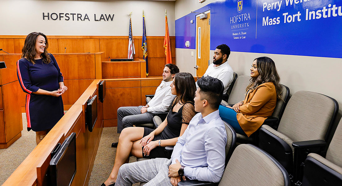 Professor and Students in the Moot Courtroom