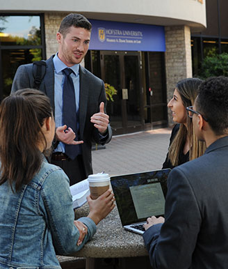 Four Law Students Studying Together Outside