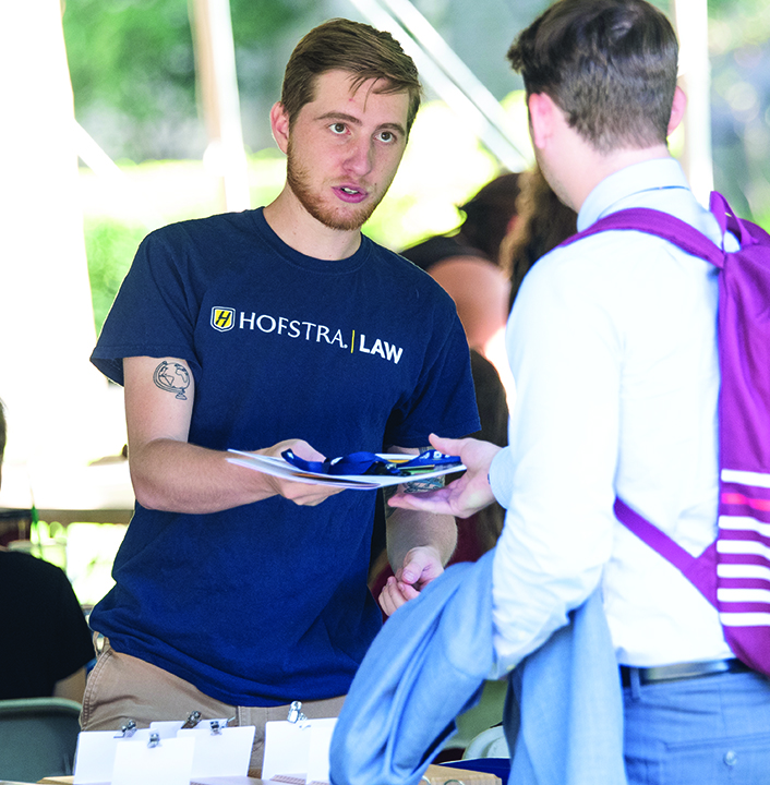 A 1L Student Signing In at Orientation