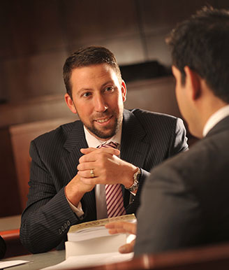 Dean Caruso Speaking with a Law Student