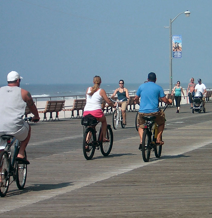 People Riding Bikes on the Long Beach Boardwalk