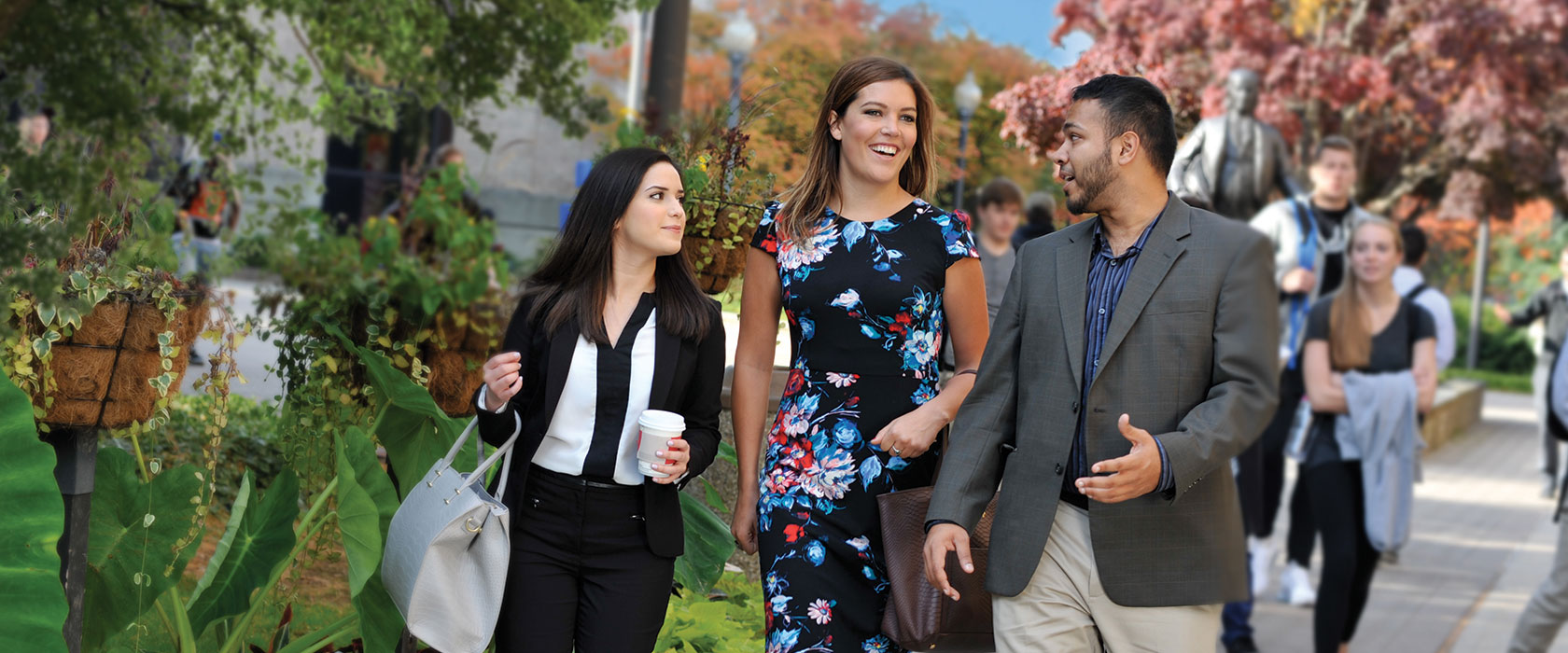 Three Law Students Walking Together on Campus