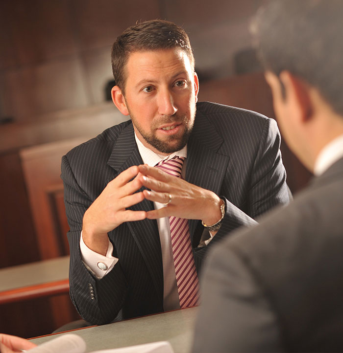 Christopher Caruso Speaking with a Student