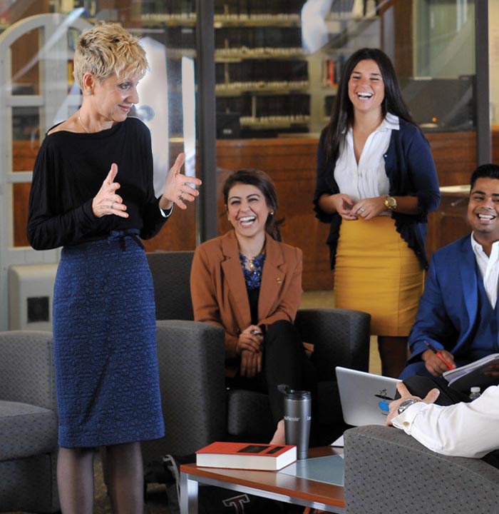 Barbara Barron Speaking with Students Outside the Law Library