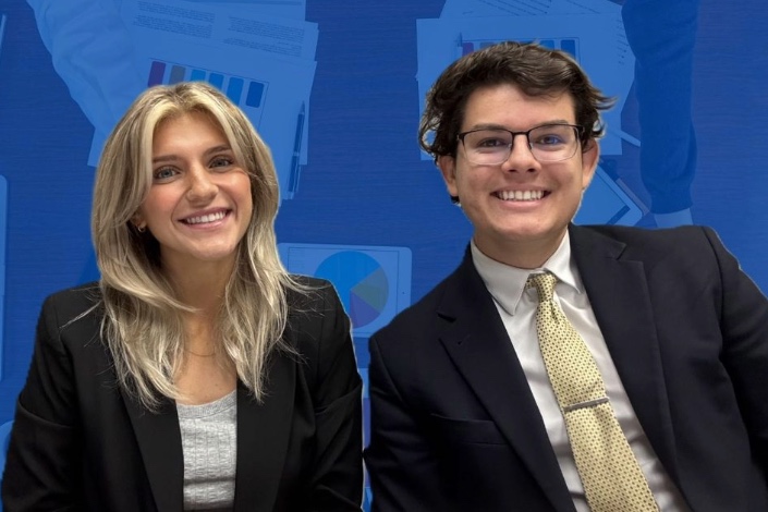 Second-year Hofstra Law students Eric Cooper and Jenna Dimech smile for a picture.