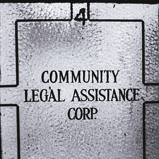 Frosted glass door with the words Community Legal Assistance Corp. and the number 4 written above on a divider bar.